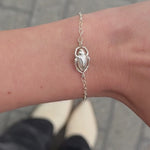 Video of the Scarab Bracelet on a fine gold chain worn on the wrist