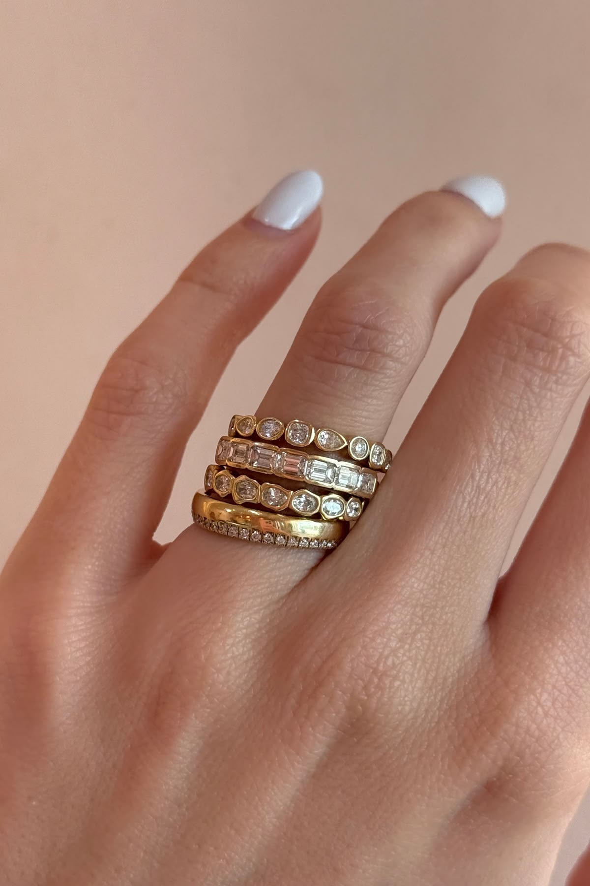 Melinda band, White Diamond Abstract Bezel Band, White Diamond Harley Ring and Simple Shapes band stacked on hand