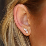 Large White Diamond Orion Studs close up on ear